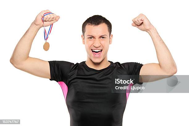 Young Happy Sportsman Holding A Gold Medal Stock Photo - Download Image Now - Leotard, Men, Achievement