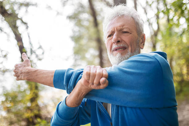 istock Senior doing stretching in the public park 1537479365