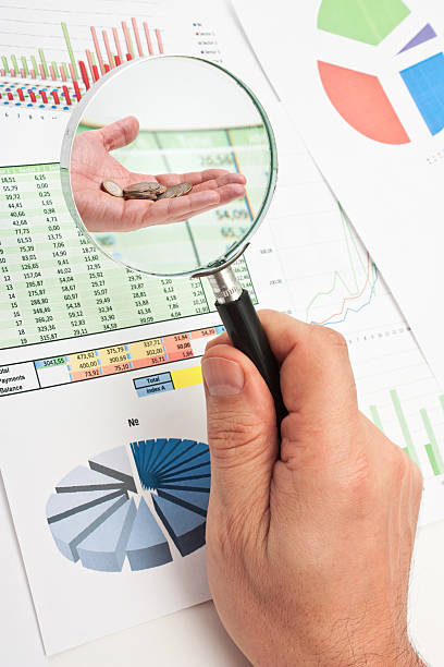istock magnifying glass in hand and paper 153747959