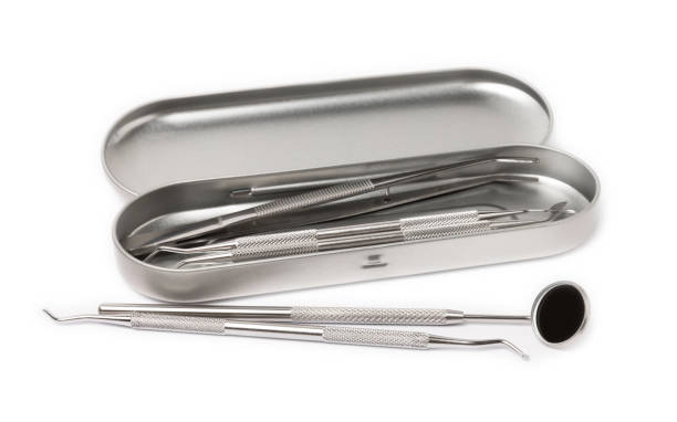 istock Dental instruments isolated on white background. Professional tools for oral care. Whitens teeth, stimulates gums, removes plaque and tartar. Clean teeth.Dentistry concept. mockup 1537484097