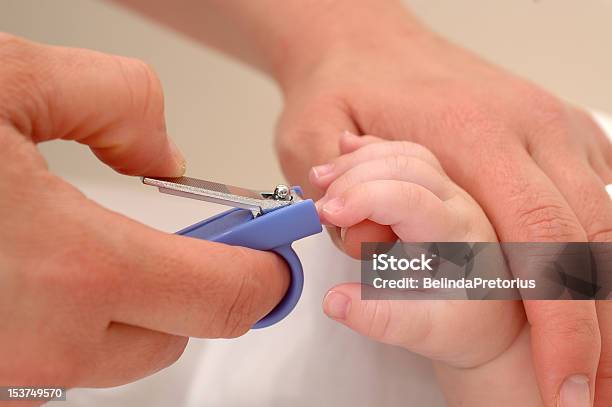 Closeup Of Mother Cutting An Infants Fingernails Stock Photo - Download Image Now - Fingernail, Baby - Human Age, Cutting