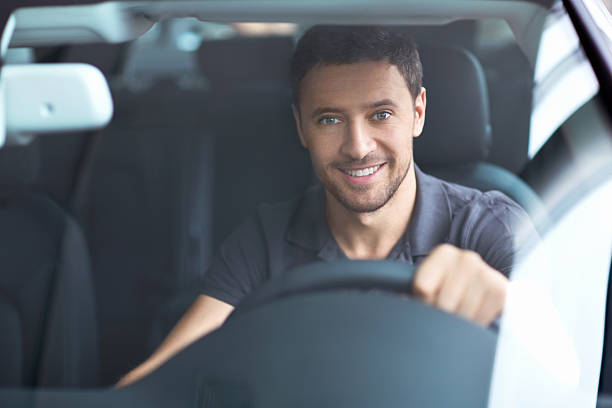 istock A smiling man behind the wheel 153750058