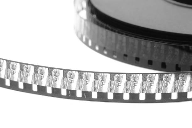 stack of old movie film on plastic reel stock photo