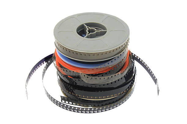 stack of old movie film on plastic reel stock photo