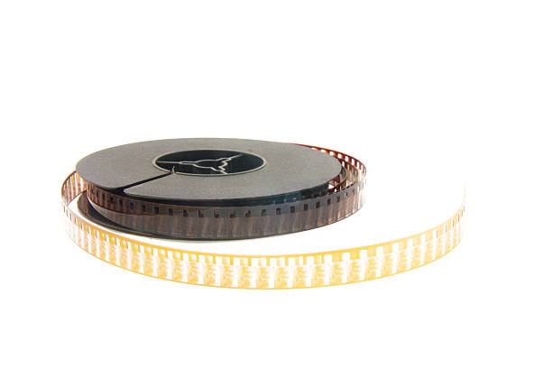 stack of old movie film on plastic reel stock photo