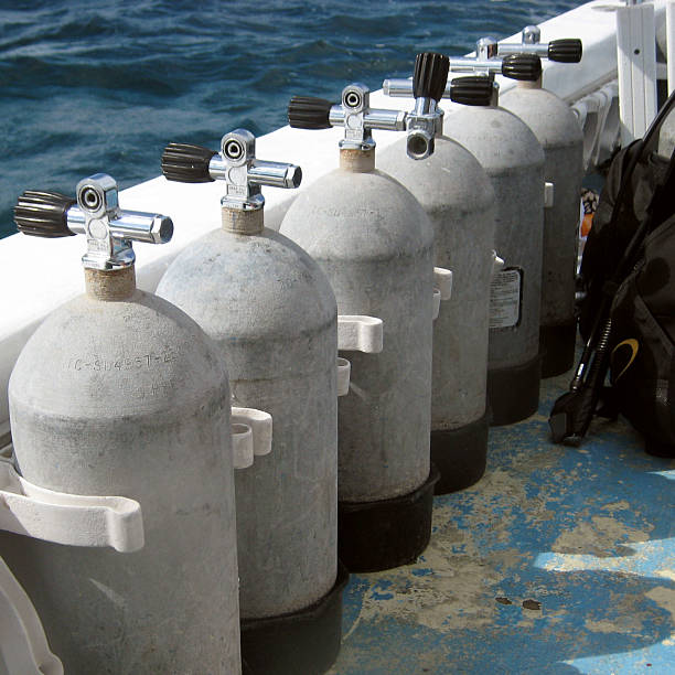 Steel scuba tanks Steel scuba tanks on the dive boat trishz stock pictures, royalty-free photos & images