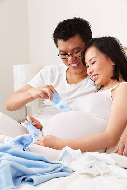 istock Asian couple playing socks over unborn baby 153750727