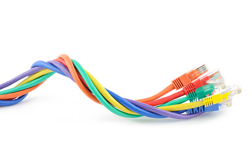 Multi colored computer network cables isolated on white background