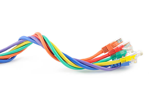 Various multicolored computer cables Multi colored computer network cables isolated on white background computer cable stock pictures, royalty-free photos & images