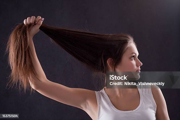 Girl Holding Her Hair Stock Photo - Download Image Now - 20-24 Years, Adult, Brown Hair