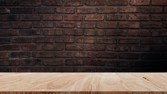 Brick wall with wooden floor the background space of the interior, wooden floor with Empty brick for background.
