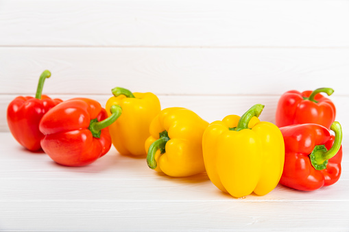 Fresh colorful  bell pepper on  textured wooden background. Bell pepper. Vegetables. Vegan food. Healthy foods. Place for text. Place to copy. Diet concept.