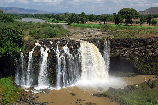 Ouzoud Falls is the collective name for several waterfalls that empty into the El-Abid River's gorge. This popular tourism destination is located near the Middle Atlas village of Tanaghmeilt, in the province of Azilal, 150 km northeast of Marrakech, Morocco. 'Ouzoud' means \