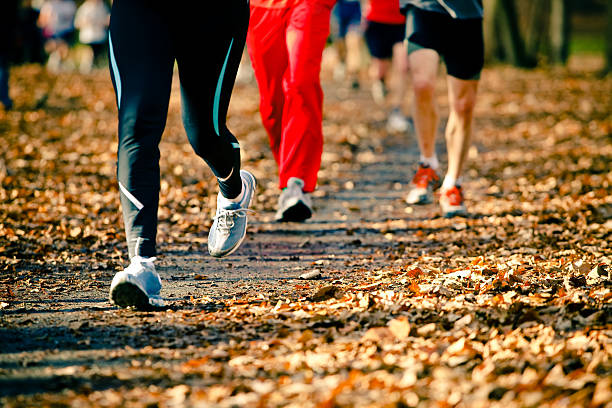 istock People running in the autumn race 153752226