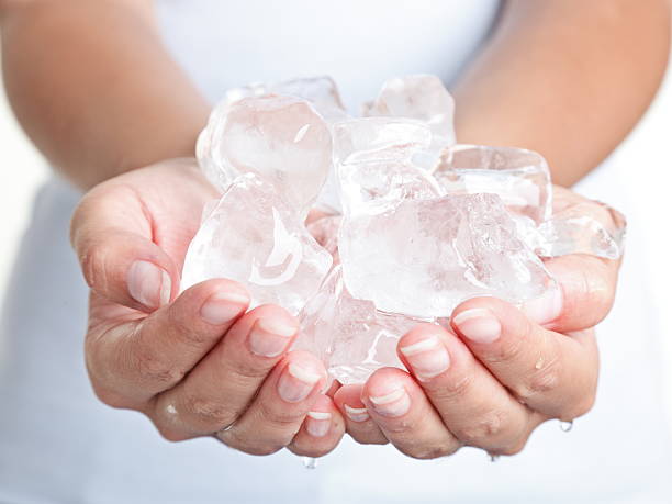 Ice cold hands stock photo