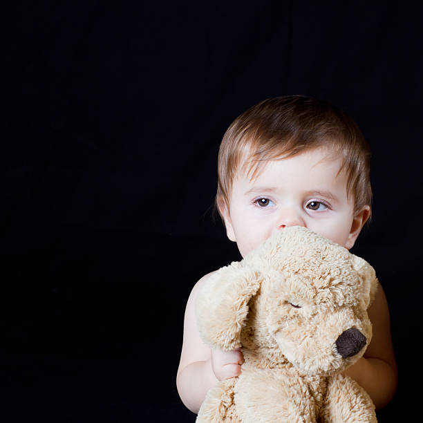 istock Baby boy playing with his puppet dog 153752542