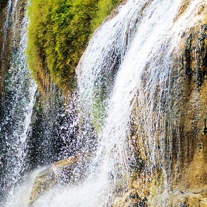 Detail of Waterfall at Kiwae Noi river in Kanchanaburi seen from river in Sai Yok National Park