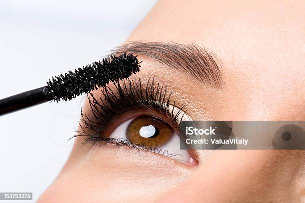 Woman Applying Mascara On Eyelashes Stock Photo - Download Image Now - Eye, Mascara, Adult