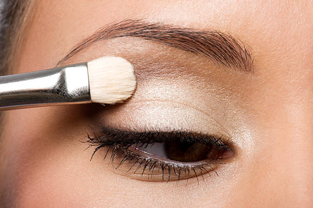 istock woman applying eyeshadow on eyelid 153753294