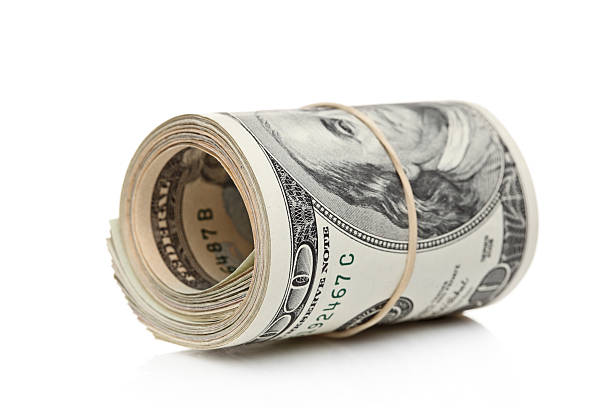 istock US dollars rolled up and tightened with band 153753392