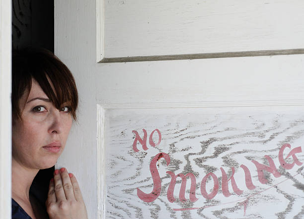 Woman opening Door stock photo