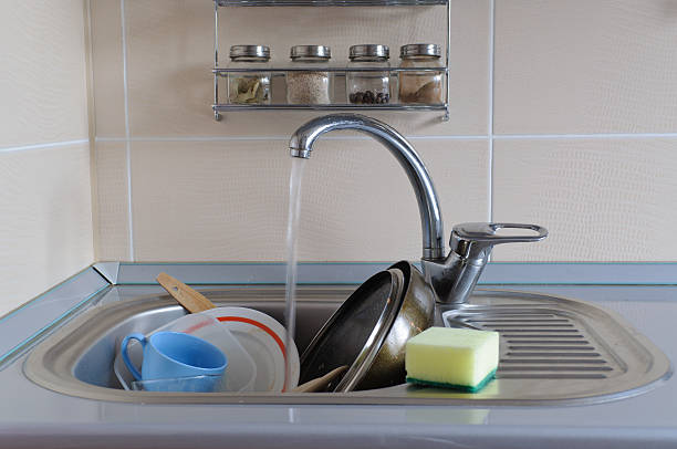 istock Dirty dishes in the sink 153754058