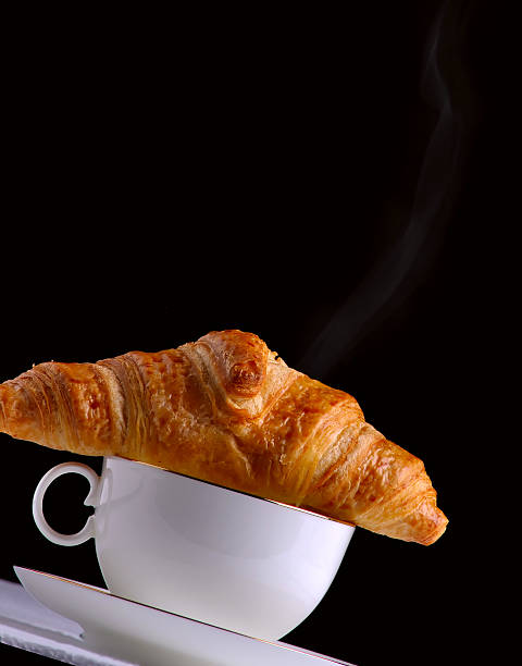 Coffee and a croissant stock photo