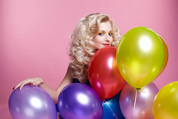 istock blonde girl with balloons 153755095