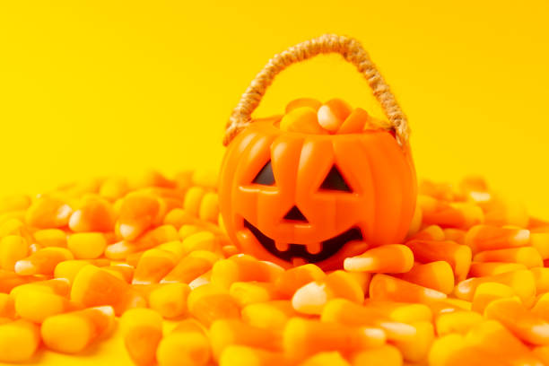 Halloween candy treats. Pumpkin candy with copy space. Background.