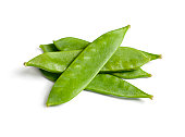 Fresh snow peas in a pile on white background