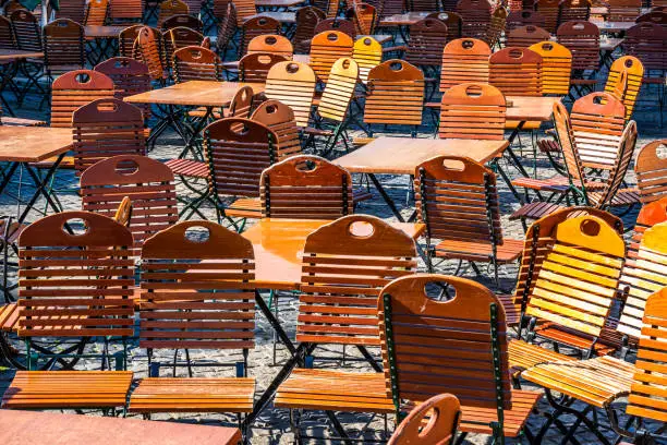 table and chairs at a typical bavarian beergarden - photo