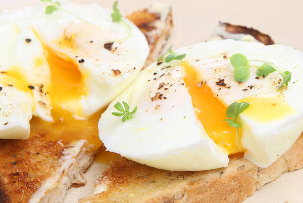 istock Close-up of poached eggs on toast 153756314