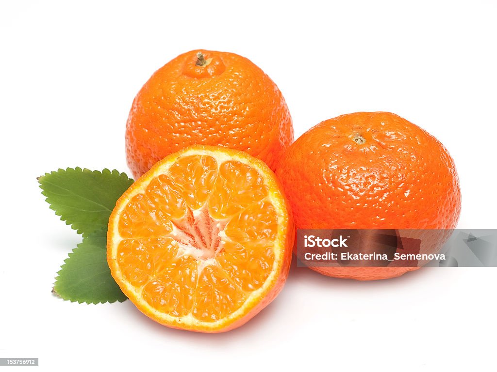 Ripe tangerines with leaves and slices Ripe tangerines with leaves and slices on white background Citrus Fruit Stock Photo