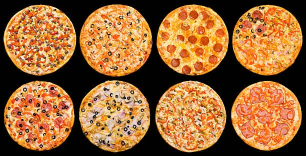 eight different pizzas in one set, isolated on black, top view