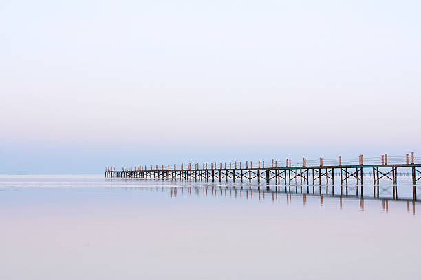 istock Bridge going out to sea 153757460
