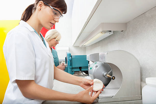 Dental Assistant with Tooth Impression stock photo