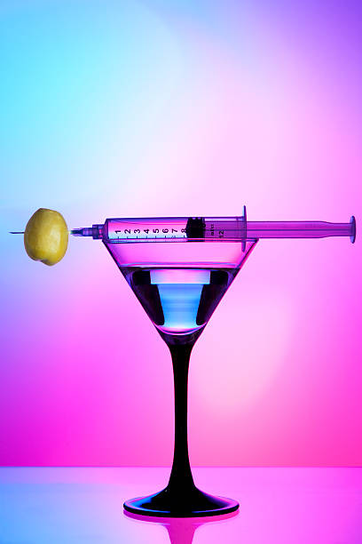 Syringe, olive, and cocktail stock photo