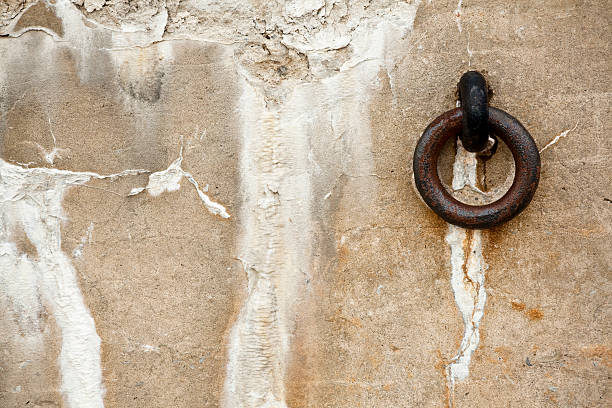 istock Metal Ring on a Decaying Stone Wall 153759190