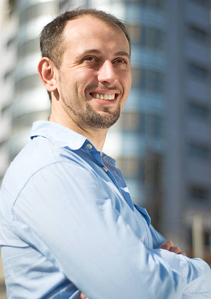 istock Portrait of young smiling man 153759348