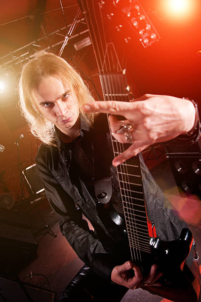 istock Long haired guitarist is playing 153759481