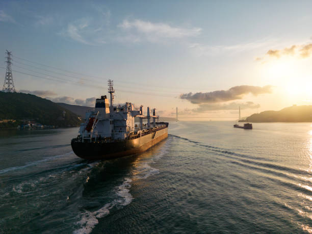 istock Aerial view of cargo ship in transit at sunset. 1537595094
