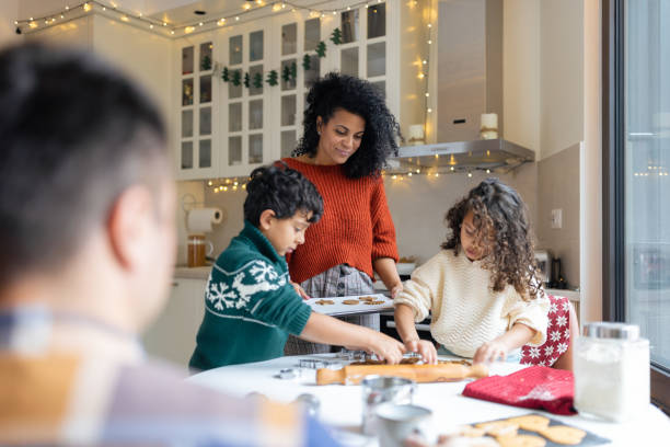 istock Multiracial family joyfully baking Christmas cookies 1537599681