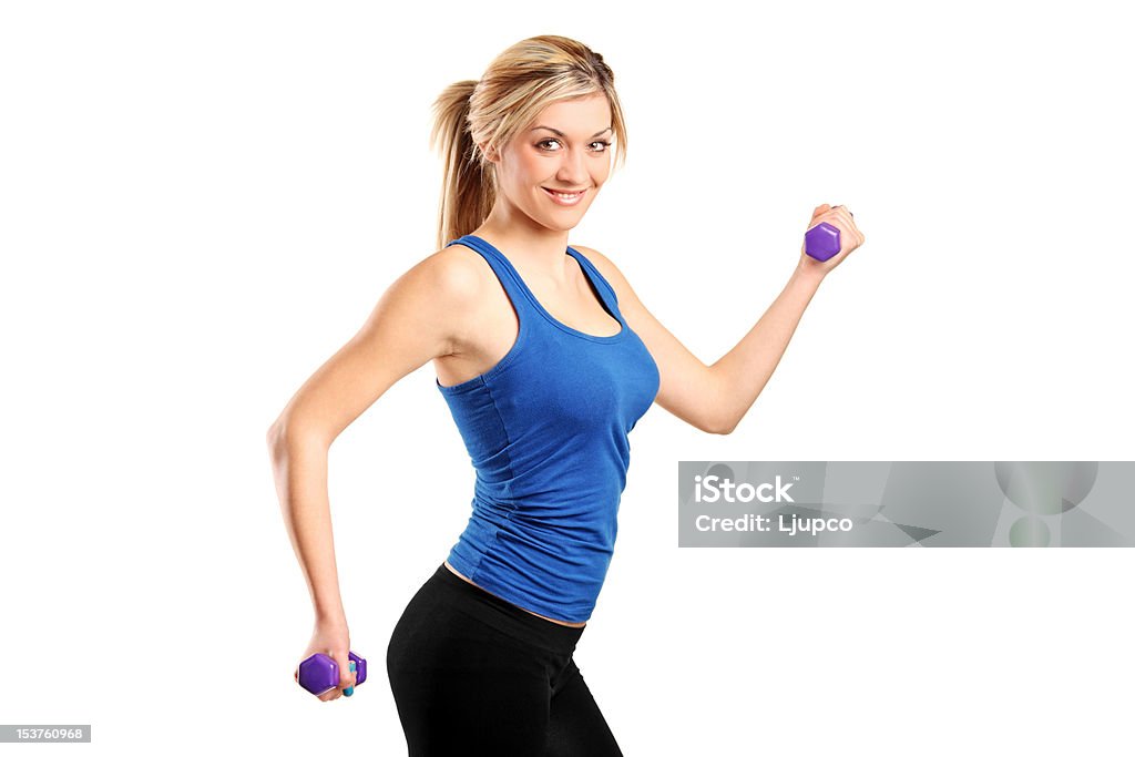 Young attractive woman with weights Young attractive woman with weights isolated on white background Adult Stock Photo