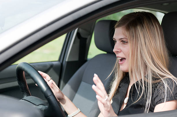 istock Before accident - young woman driving car 153761093
