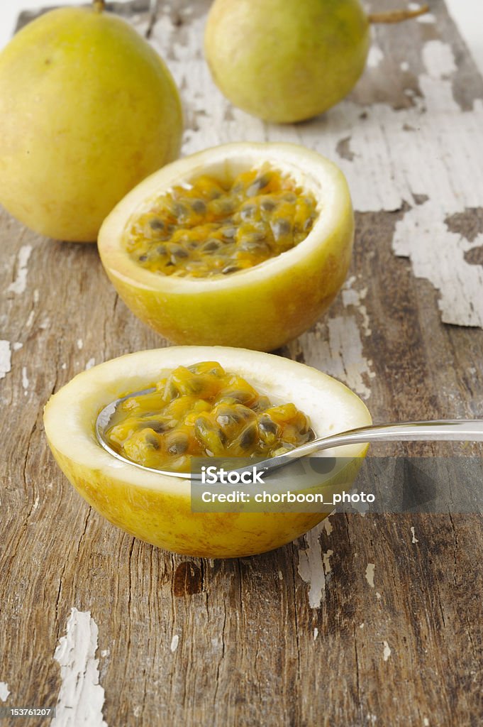 green passionfruit on spoon Close-up Stock Photo