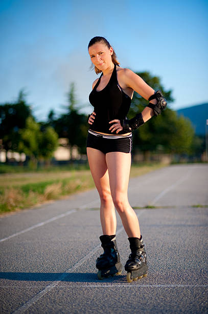 istock Cute young girl roller skates on playground 153761478