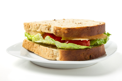 Vegetarian Sandwich of cheese, tomato and lettuce on brown Granary bread.