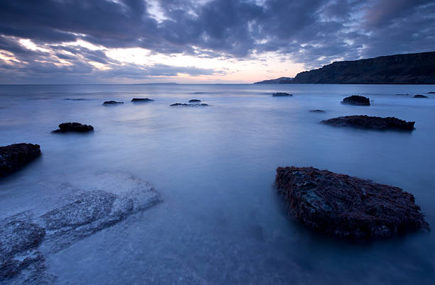 Brooding light across Kimmeridge Bay stock photo