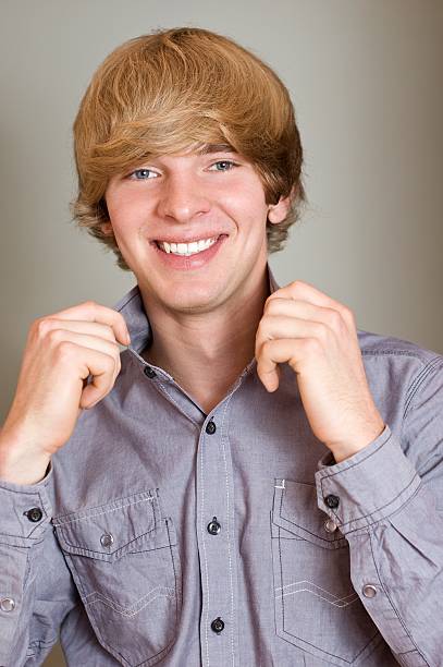 istock Portrait of a young handsome man holding his collar 153762086