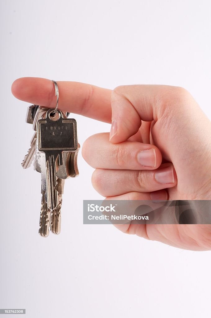 Giving the key A hand with keys for the house/car, the old owner/agent gives the key to the buyer Adult Stock Photo